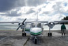 A Caroline Islands Air plane sits on an outer island airstrip