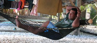 A Mwoakillese man kicks back in a hammock