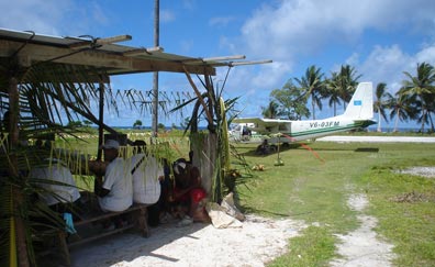 A Caroline Islands Air plane near the airfield hut